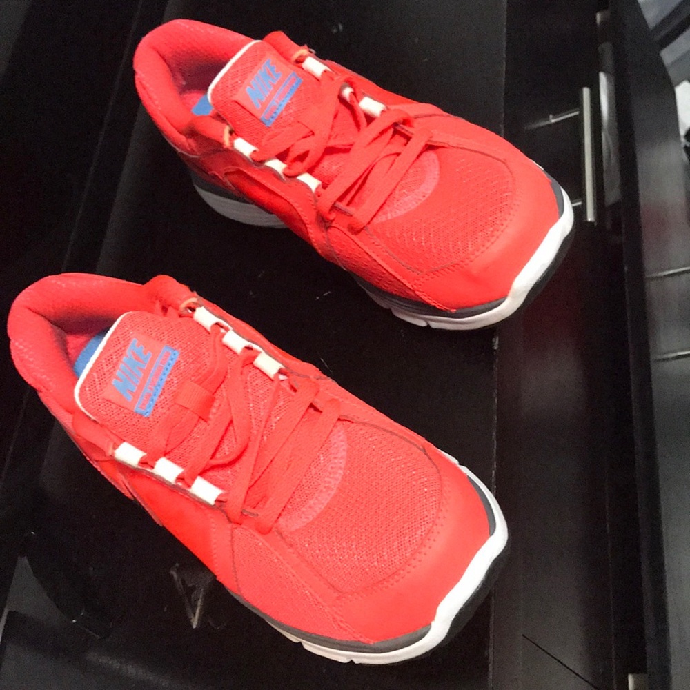Orange Nike running shoes